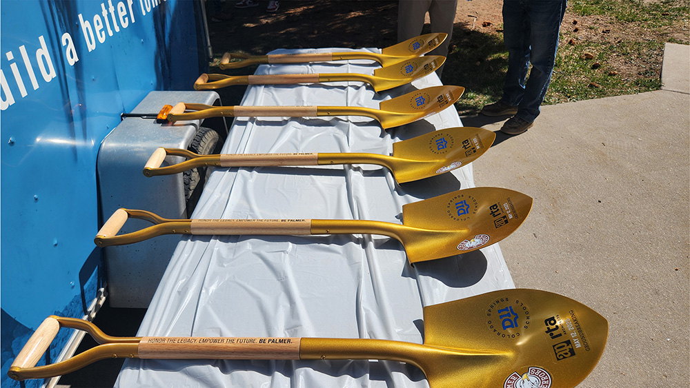golden shovels with logos for the groundbreaking