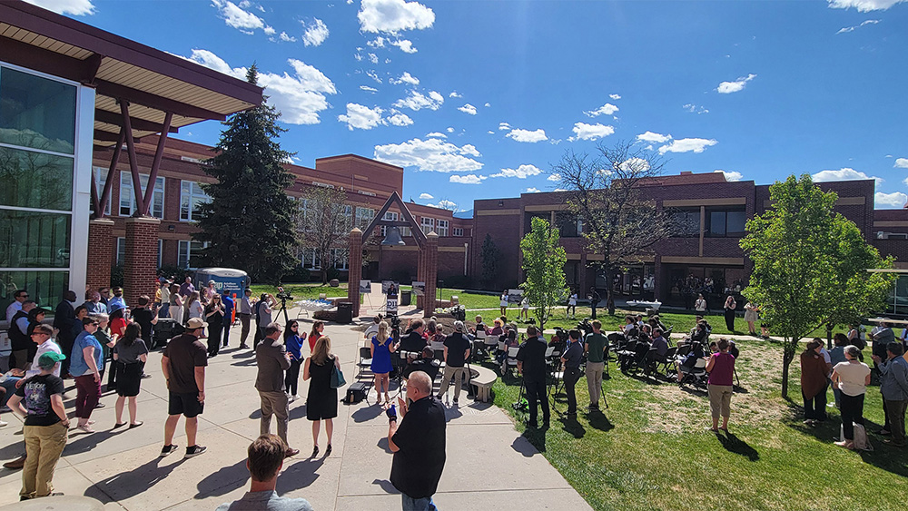 a crowd gathered at the palmer high school groundbreaking ceremony
